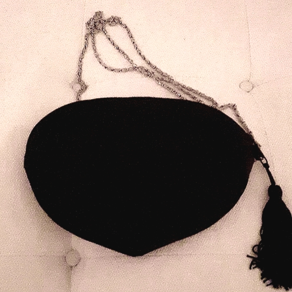 Silk quilted evening bag with tassel